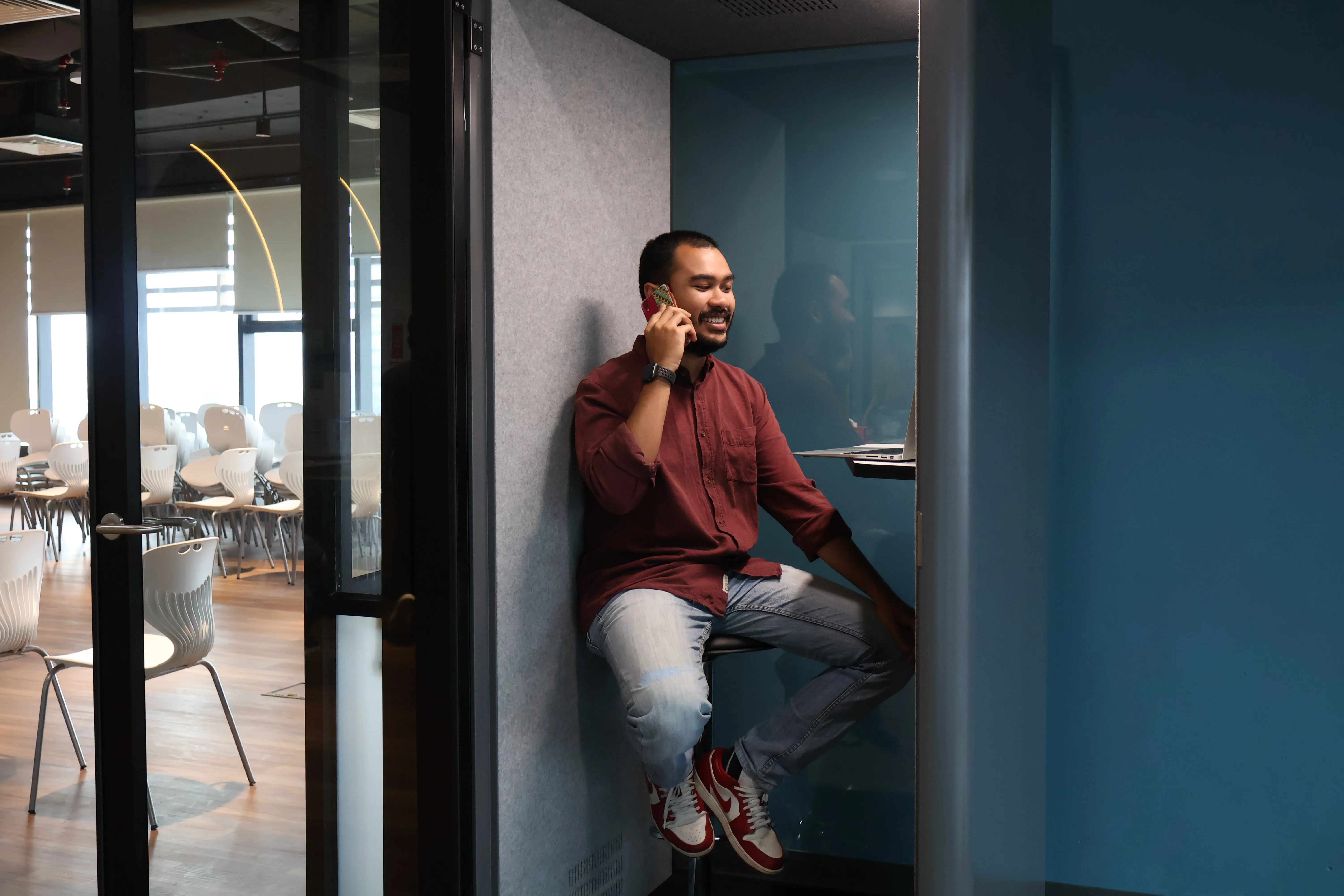 Soundproof phone booth interior at a WORQ coworking space in Kuala Lumpur