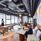 Modern coworking space in KL Sentral with professionals working at shared coworking area in the background.
