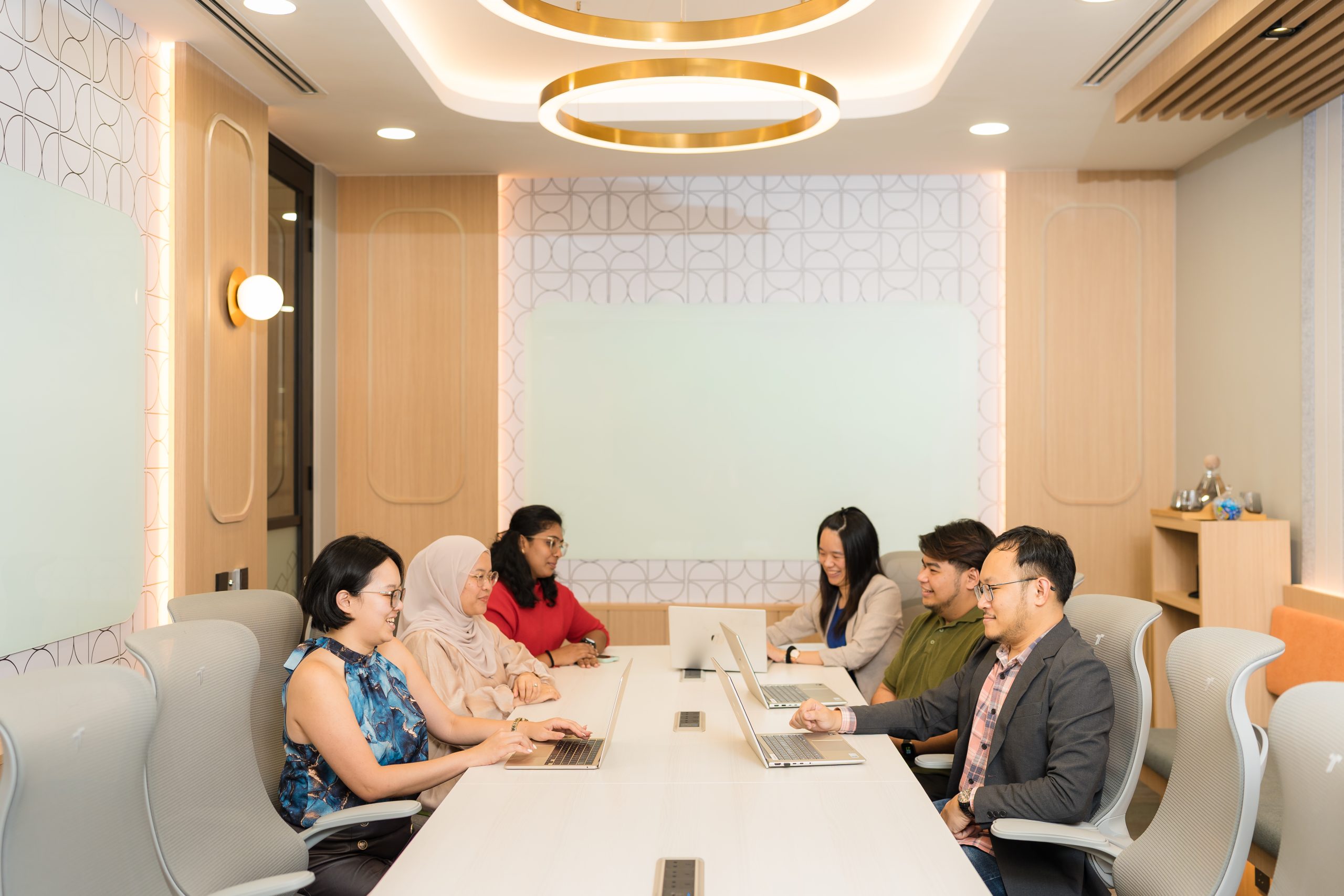 People collaborating in a WORQ Bandar Utama meeting room