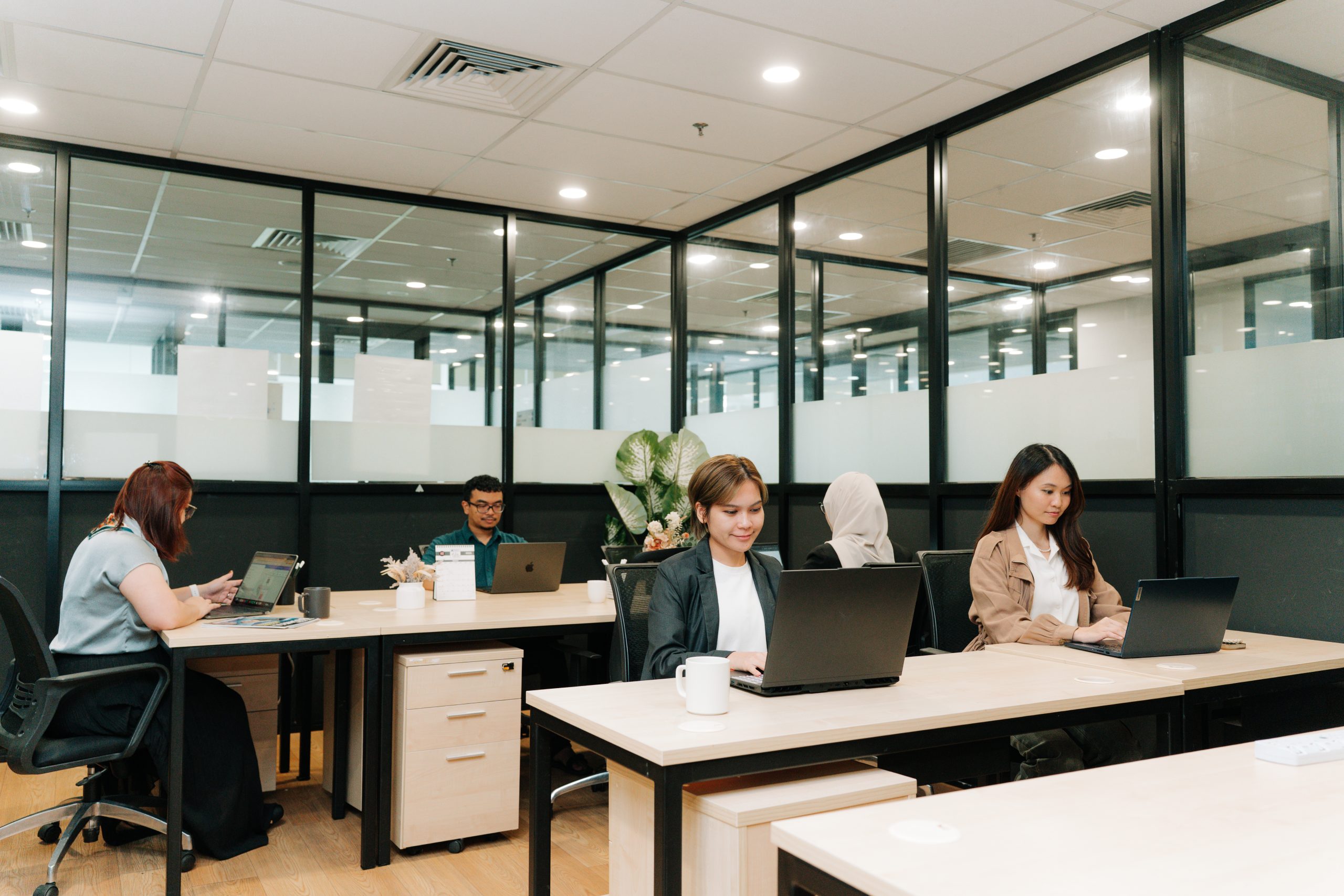 Members working at shared desks in WORQ Subang